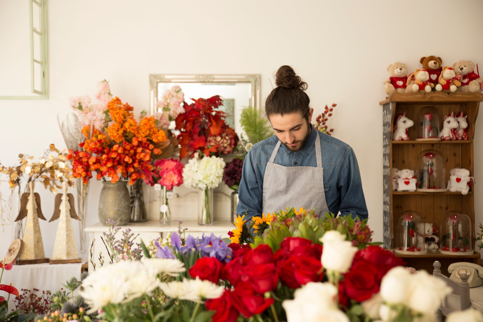 Interior of the Bloom & Co. flower shop workspace with buckets of fresh flowers